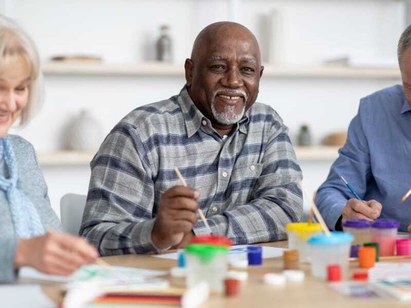 senior man painting
